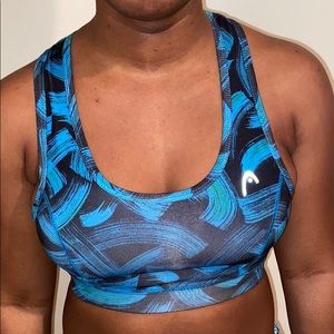 A blue and black sports bra .